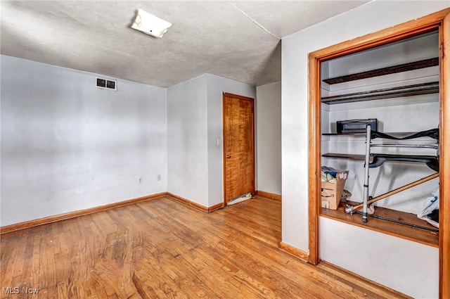 unfurnished bedroom with light hardwood / wood-style floors