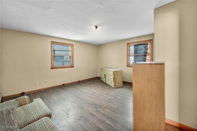 spare room featuring dark wood-type flooring