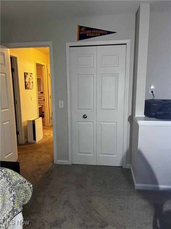 carpeted bedroom featuring a closet