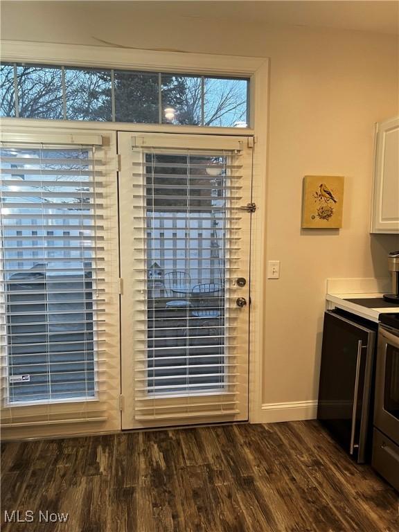 entryway with dark wood-type flooring