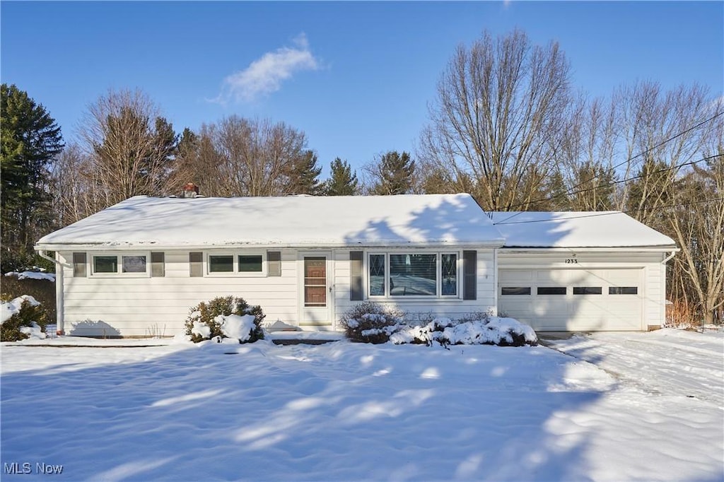 single story home with a garage