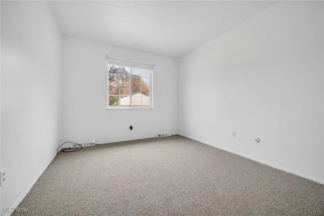 empty room featuring carpet flooring