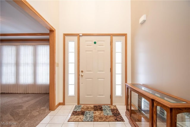 view of carpeted foyer entrance