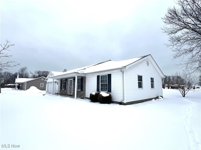 view of snow covered house