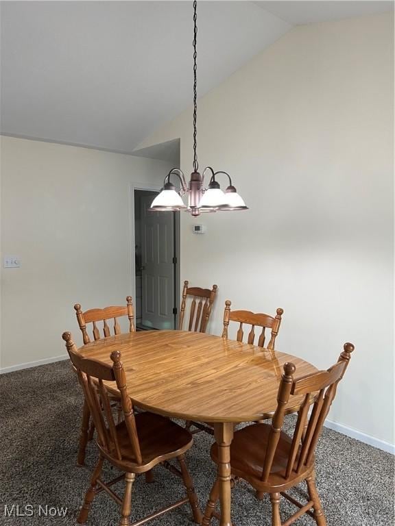 carpeted dining area featuring vaulted ceiling and an inviting chandelier