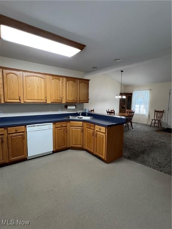 kitchen with dishwasher, light carpet, sink, hanging light fixtures, and a chandelier