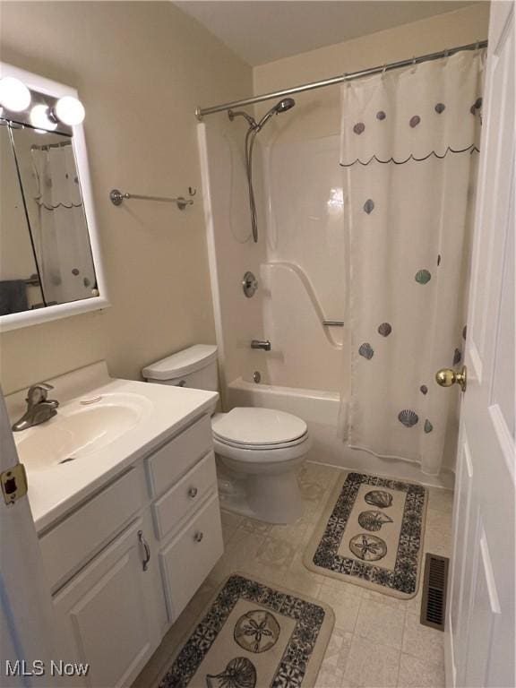 full bathroom featuring toilet, vanity, and shower / tub combo with curtain