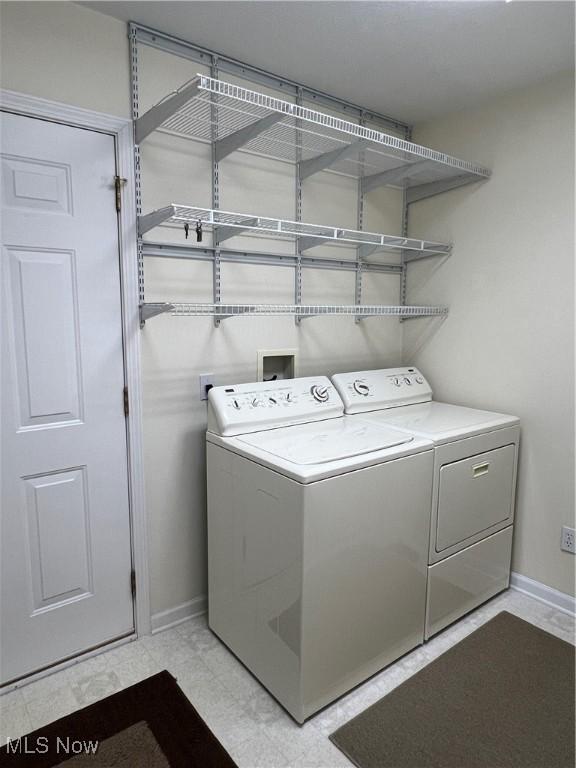 laundry room with washer and dryer