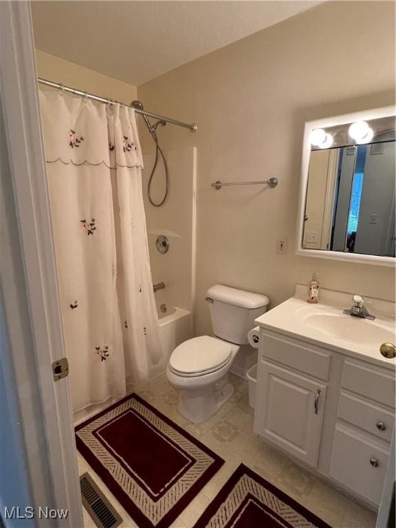 full bathroom with toilet, shower / bath combo, and vanity