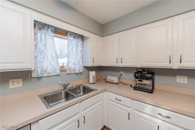 kitchen with white cabinets and sink