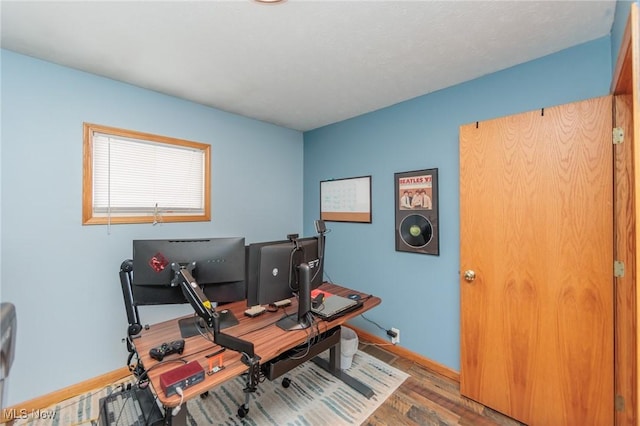 home office with hardwood / wood-style floors