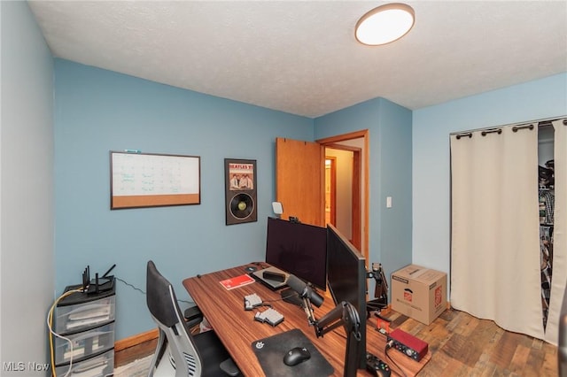 home office featuring hardwood / wood-style flooring