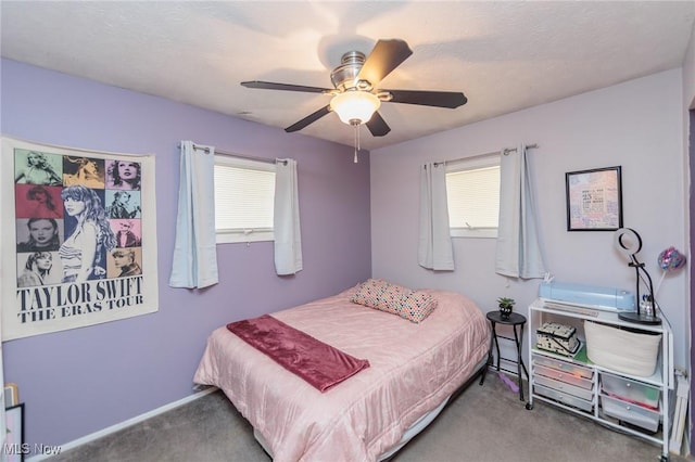 bedroom with ceiling fan and carpet flooring