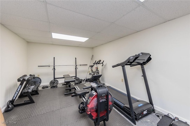 workout area with a paneled ceiling