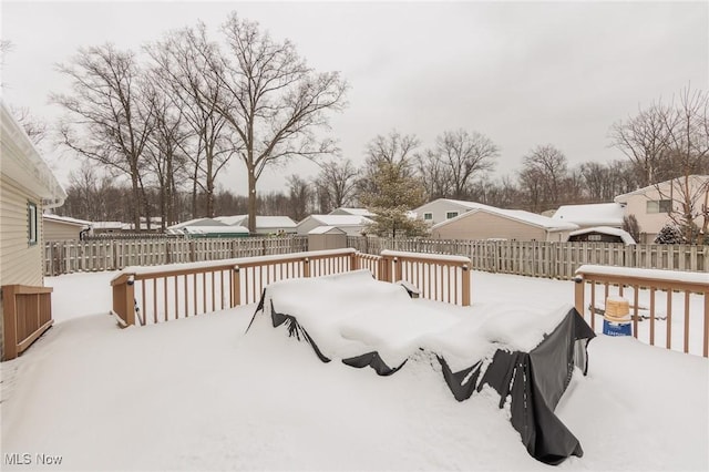 view of snow covered deck