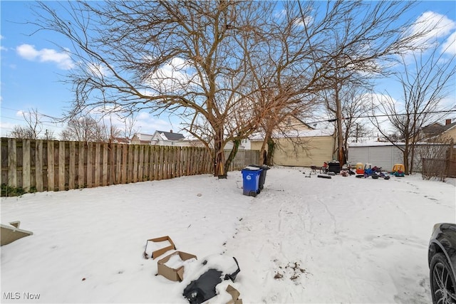 view of yard covered in snow