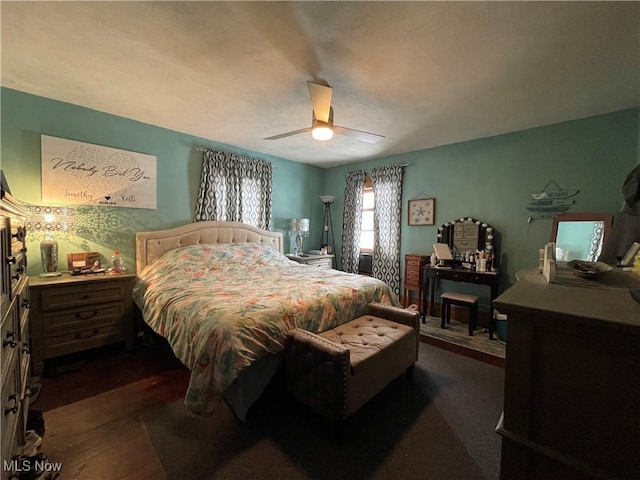 bedroom with dark wood-type flooring and ceiling fan