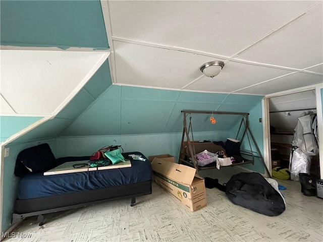 bedroom with lofted ceiling