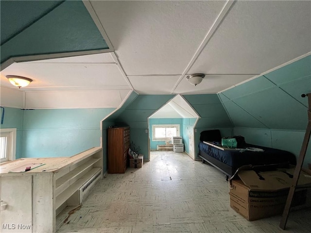 additional living space featuring vaulted ceiling