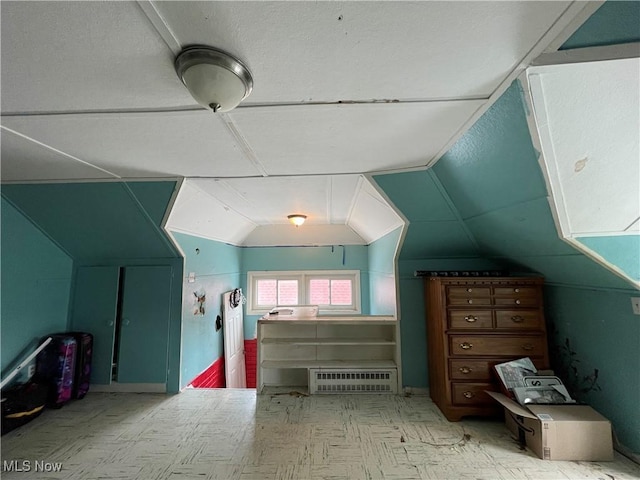 bonus room with vaulted ceiling