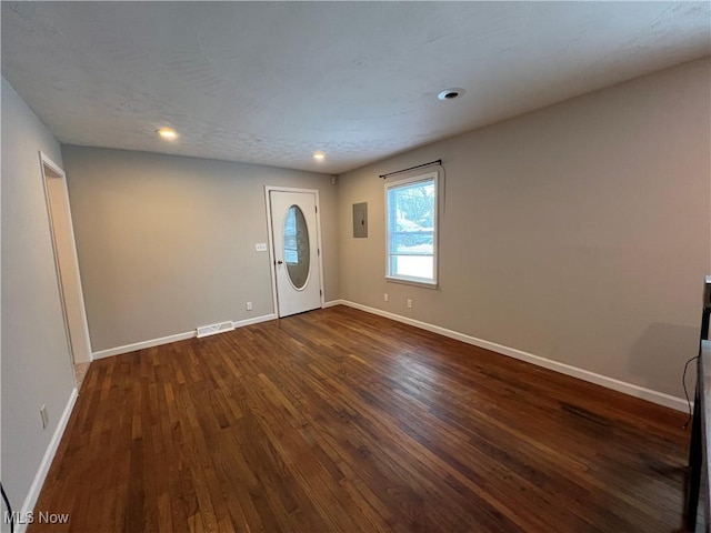 entrance foyer featuring dark hardwood / wood-style flooring and electric panel