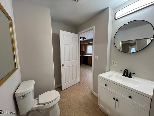 bathroom featuring toilet and vanity