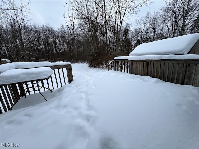 view of yard layered in snow