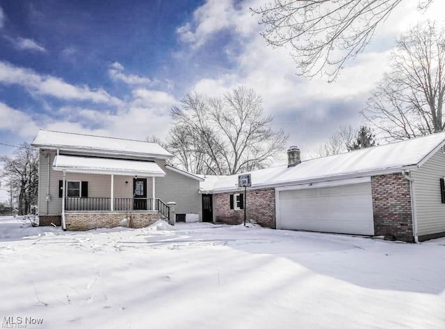 view of front of property with a garage and a porch