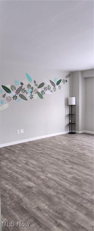 unfurnished room featuring dark hardwood / wood-style floors