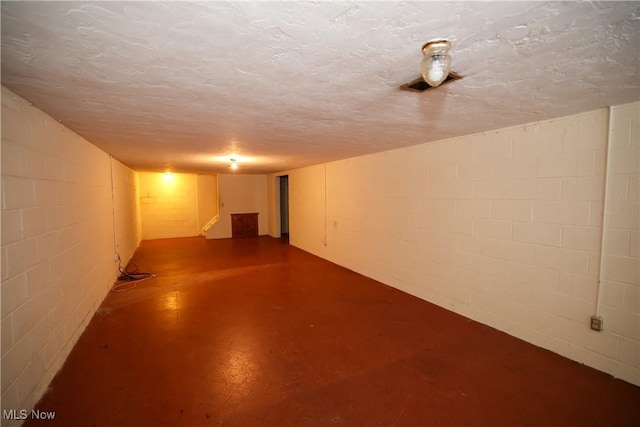 basement with a textured ceiling