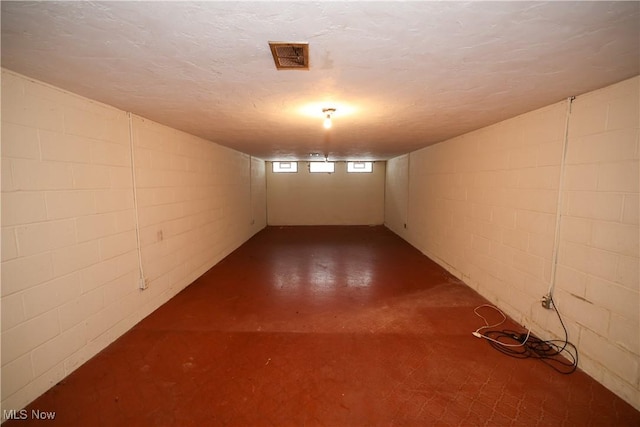 basement with a textured ceiling