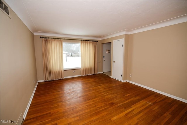 spare room with hardwood / wood-style floors