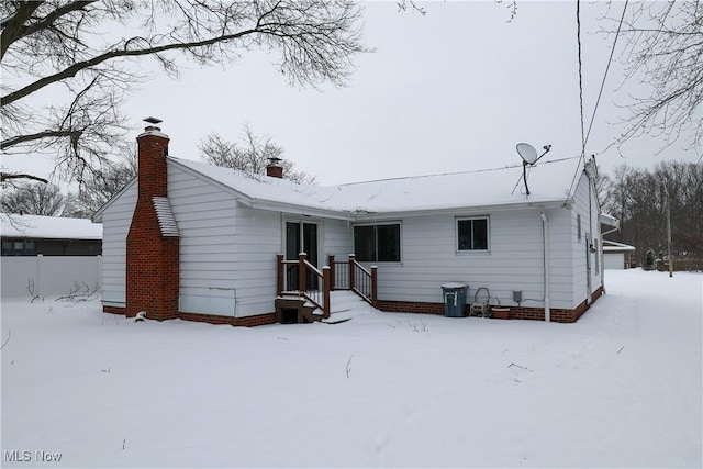 view of snow covered house