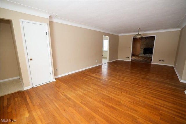 interior space featuring hardwood / wood-style flooring and ornamental molding