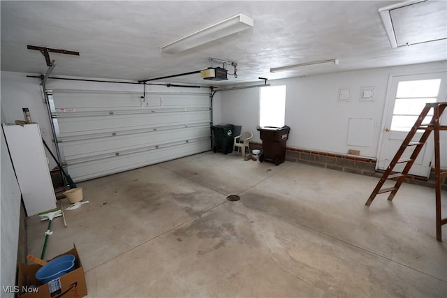 garage featuring a garage door opener