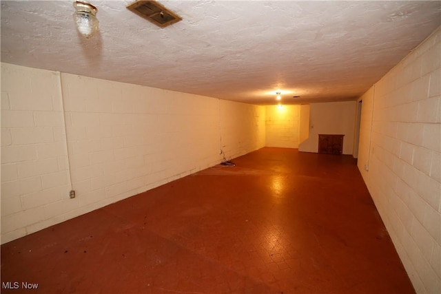 basement with a textured ceiling