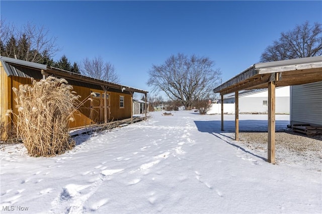 view of yard layered in snow