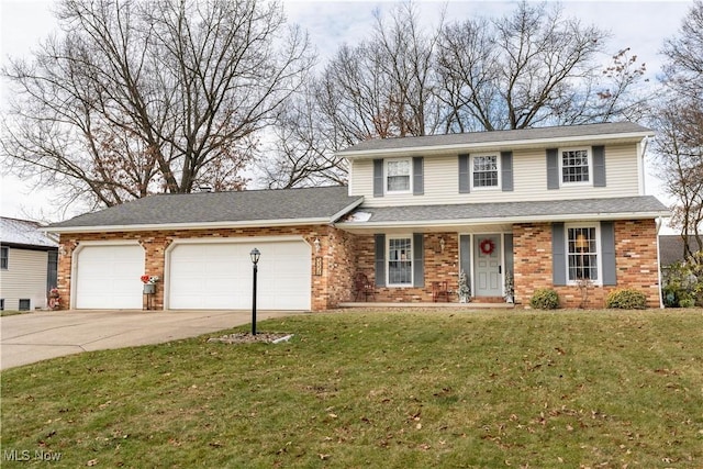 view of front facade with a front yard and a garage