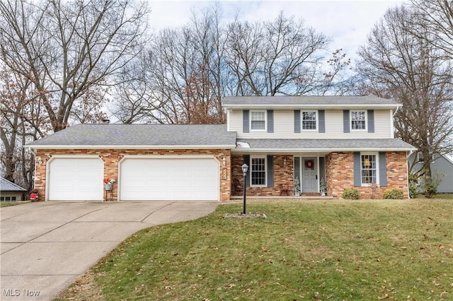 view of front property featuring a front yard and a garage