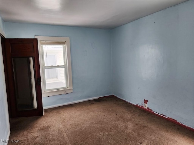 empty room with carpet flooring