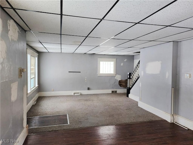 basement with hardwood / wood-style floors