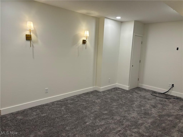 basement featuring dark carpet