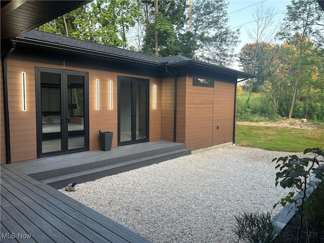 exterior space featuring french doors and a wooden deck