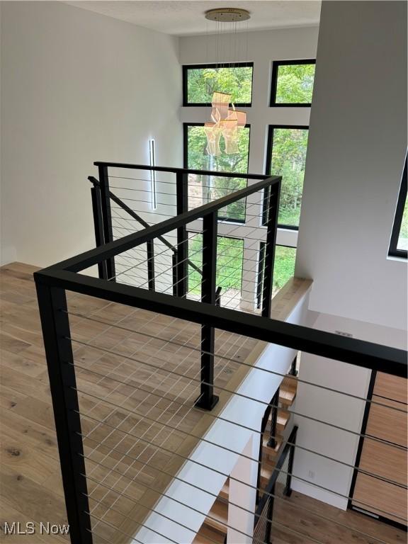 stairs featuring wood-type flooring