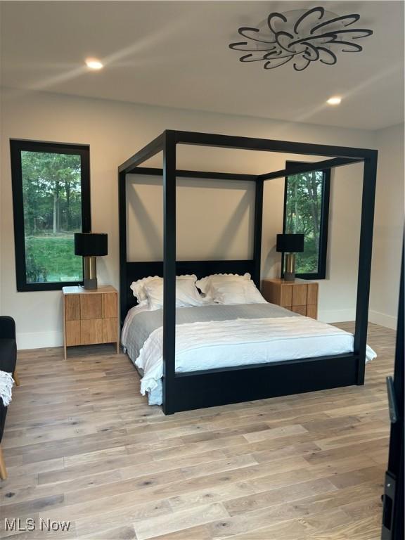 unfurnished bedroom with light hardwood / wood-style flooring