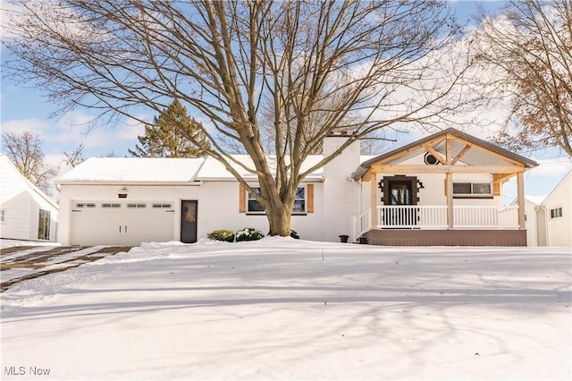 view of front of property featuring a garage and a porch