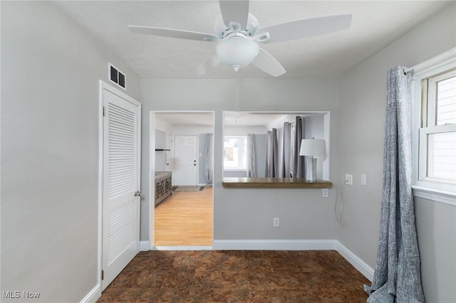 interior space featuring ceiling fan