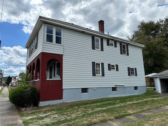 view of property exterior with a yard