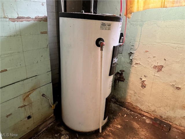 utility room featuring water heater