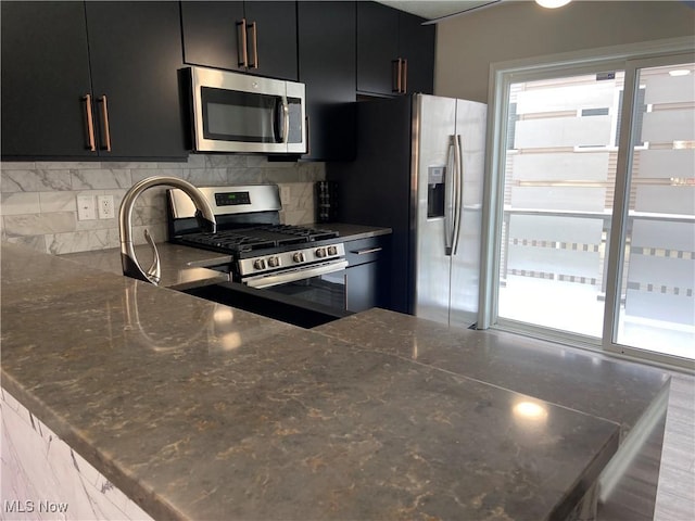 kitchen featuring tasteful backsplash and appliances with stainless steel finishes